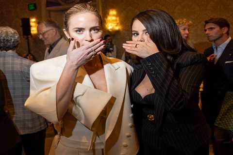 Selena Gomez and Emily Blunt cover their mouths as they pose together at the AFI Awards after viral ..